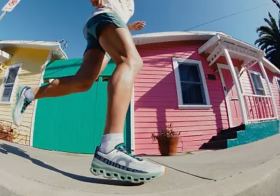 Man running in the On Cloudmonster running shoes