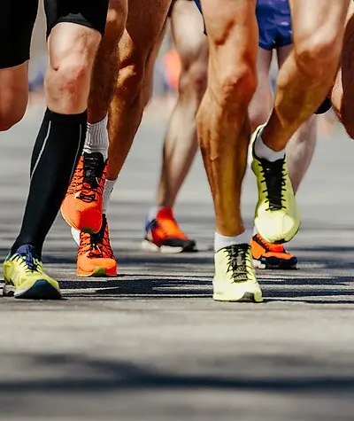 Close up of men's Negru shoes while running during a race