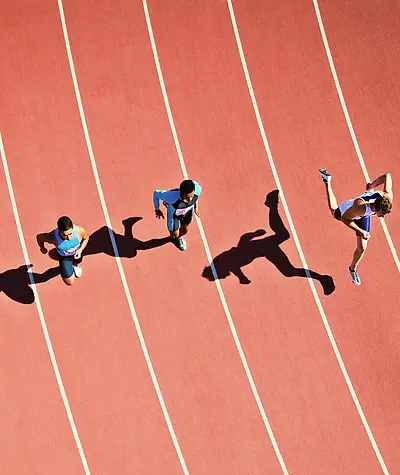 Aerial view of runners on a track