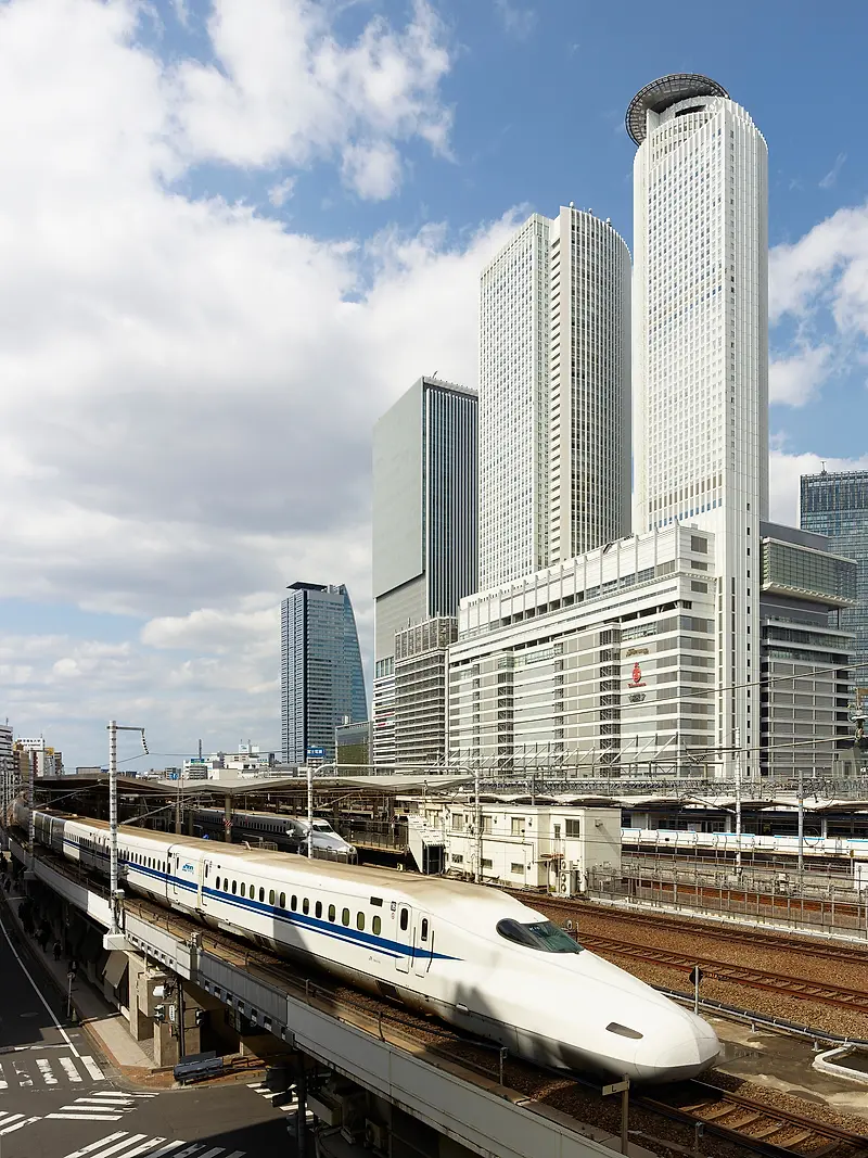 Three towers with a train pictured in front